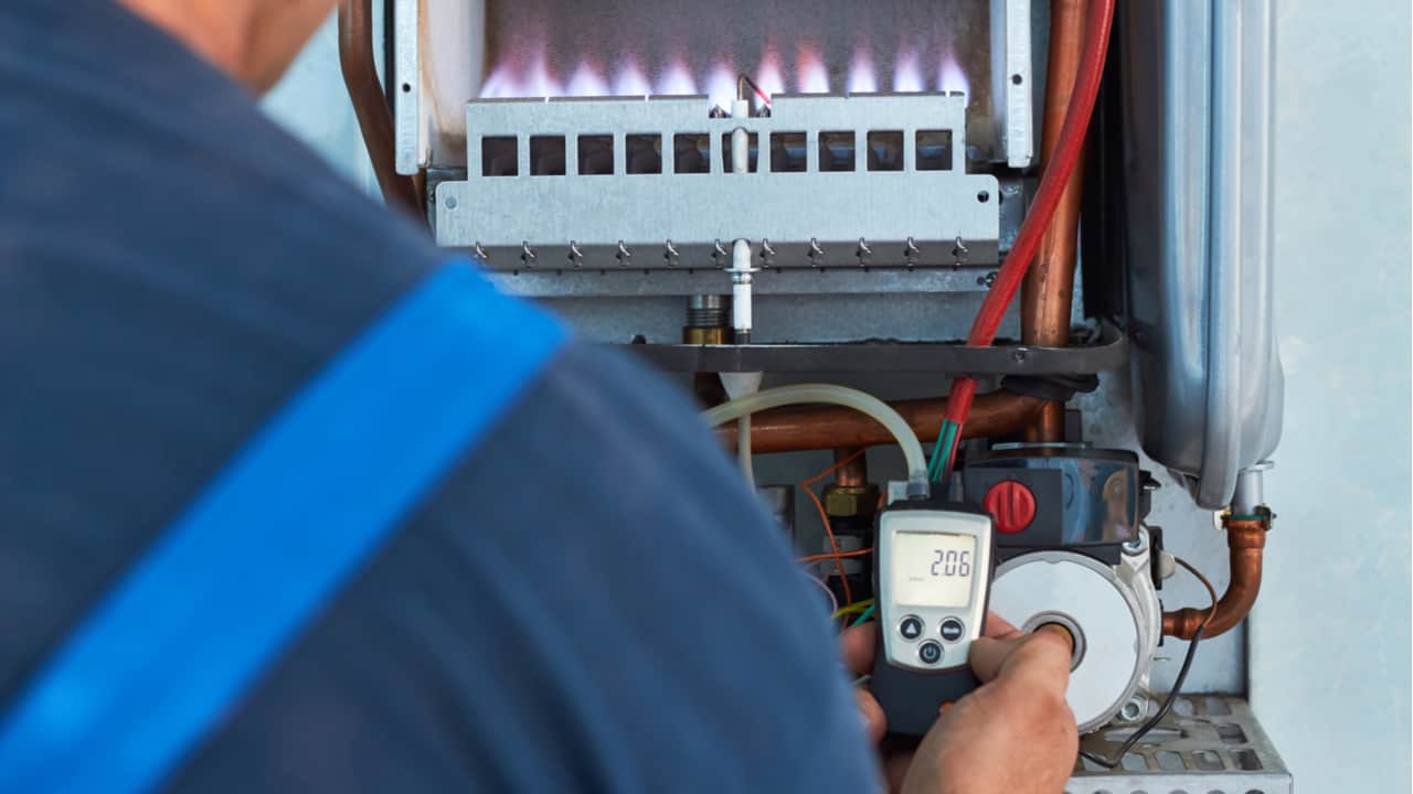 Man repairing a gas boiler