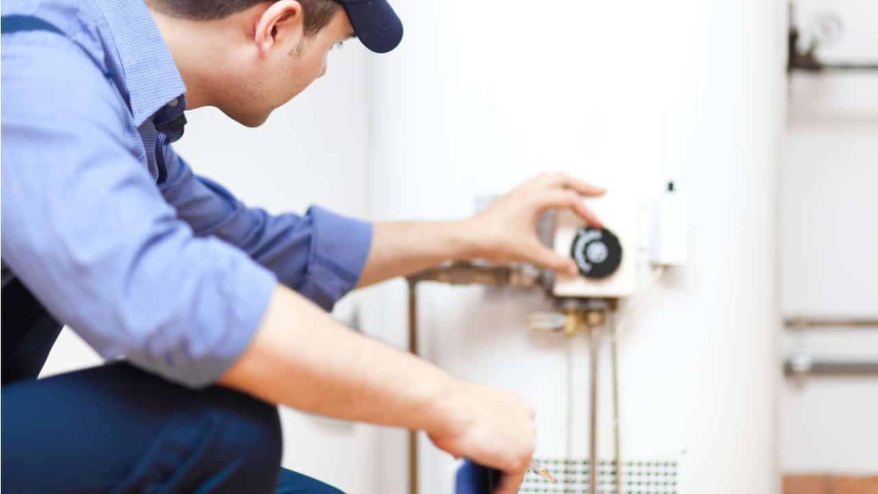 Plumber setting up a water heater