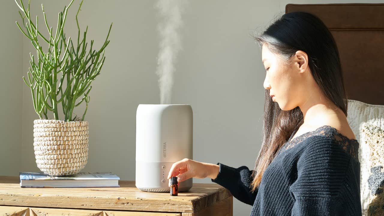 Woman uses a humidifier