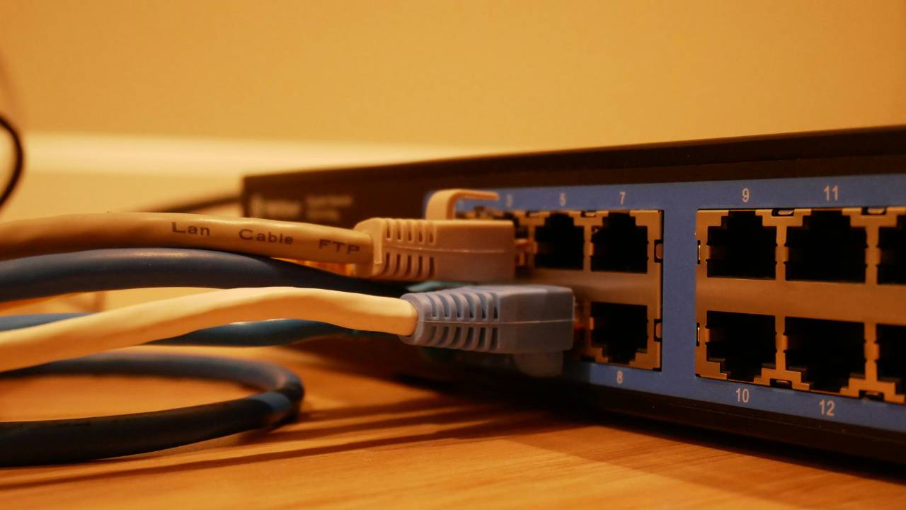 Several cables plugged into the Internet router